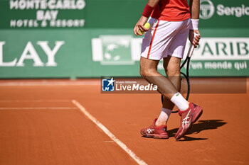2024-04-11 - Illustration of shoes and racket of Novak Djokovic during the Rolex Monte-Carlo ATP Masters 1000 tennis on April 11, 2024 at Monte Carlo Country Club in Roquebrune Cap Martin, France near Monaco. Photo Victor Joly / DPPI - TENNIS - ROLEX MONTE CARLO MASTERS 2024 - 11/04 - INTERNATIONALS - TENNIS