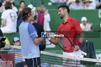 2024-04-12 - Winner Novak Djokovic of Serbia (R) salutes Alex de Minaur of Australia after their quarter-final during day 6 of the Rolex Monte-Carlo 2024, ATP Masters 1000 tennis event on April 12, 2024 at Monte-Carlo Country Club near Monaco in Roquebrune Cap Martin, France - TENNIS - ROLEX MONTE CARLO MASTERS 2024 - 12/04 - INTERNATIONALS - TENNIS