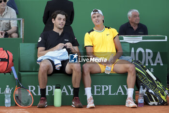 2024-04-12 - Taylor Fritz of USA and Holger Rune of Denmark in their double match during day 6 of the Rolex Monte-Carlo 2024, ATP Masters 1000 tennis event on April 12, 2024 at Monte-Carlo Country Club near Monaco in Roquebrune Cap Martin, France - TENNIS - ROLEX MONTE CARLO MASTERS 2024 - 12/04 - INTERNATIONALS - TENNIS