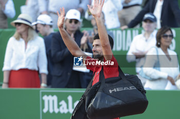 2024-04-13 - Novak Djokovic of Serbia salutes the fans following his semifinal defeat during day seven of the Rolex Monte-Carlo 2024, ATP Masters 1000 tennis event on April 13, 2024 at Monte-Carlo Country Club in Roquebrune Cap Martin, France - TENNIS - ROLEX MONTE CARLO MASTERS 2024 - 13/04 - INTERNATIONALS - TENNIS