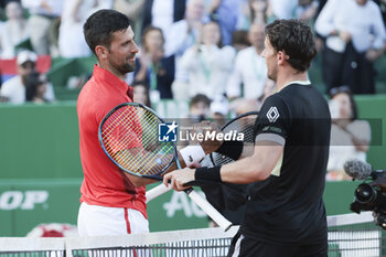 2024-04-13 - Novak Djokovic of Serbia salutes winner Casper Ruud of Norway after their semifinal during day seven of the Rolex Monte-Carlo 2024, ATP Masters 1000 tennis event on April 13, 2024 at Monte-Carlo Country Club in Roquebrune Cap Martin, France - TENNIS - ROLEX MONTE CARLO MASTERS 2024 - 13/04 - INTERNATIONALS - TENNIS
