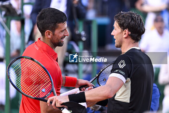 2024-04-13 - Novak Djokovic and Casper Ruud during the Rolex Monte-Carlo ATP Masters 1000 tennis on April 13, 2024 at Monte Carlo Country Club in Roquebrune Cap Martin, France near Monaco. Photo Victor Joly / DPPI - TENNIS - ROLEX MONTE CARLO MASTERS 2024 - 13/04 - INTERNATIONALS - TENNIS