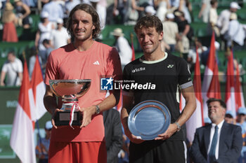 2024-04-14 - Winner Stefanos Tsitsipas of Greece and finalist Casper Ruud of Norway during the podium ceremony on day 8 of the Rolex Monte-Carlo 2024, ATP Masters 1000 tennis event on April 14, 2024 at Monte-Carlo Country Club in Roquebrune Cap Martin, France - TENNIS - ROLEX MONTE CARLO MASTERS 2024 - 14/04 - INTERNATIONALS - TENNIS