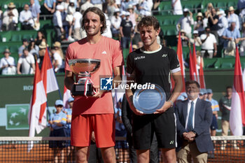 2024-04-14 - Winner Stefanos Tsitsipas of Greece and finalist Casper Ruud of Norway during the podium ceremony on day 8 of the Rolex Monte-Carlo 2024, ATP Masters 1000 tennis event on April 14, 2024 at Monte-Carlo Country Club in Roquebrune Cap Martin, France - TENNIS - ROLEX MONTE CARLO MASTERS 2024 - 14/04 - INTERNATIONALS - TENNIS