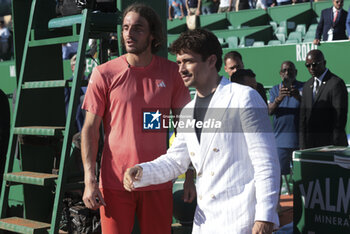2024-04-14 - Winner Stefanos Tsitsipas of Greece chats with Charles Leclerc following the final on day 8 of the Rolex Monte-Carlo 2024, ATP Masters 1000 tennis event on April 14, 2024 at Monte-Carlo Country Club in Roquebrune Cap Martin, France - TENNIS - ROLEX MONTE CARLO MASTERS 2024 - 14/04 - INTERNATIONALS - TENNIS