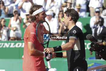 2024-04-14 - Winner Stefanos Tsitsipas of Greece salutes finalist Casper Ruud of Norway at the net after their final during day 8 of the Rolex Monte-Carlo 2024, ATP Masters 1000 tennis event on April 14, 2024 at Monte-Carlo Country Club in Roquebrune Cap Martin, France - TENNIS - ROLEX MONTE CARLO MASTERS 2024 - 14/04 - INTERNATIONALS - TENNIS