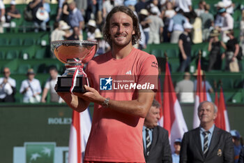 2024-04-14 - Winner Stefanos Tsitsipas of Greece celebrates during the podium ceremony after his victory in the final against Casper Ruud of Norway during day 8 of the Rolex Monte-Carlo 2024, ATP Masters 1000 tennis event on April 14, 2024 at Monte-Carlo Country Club in Roquebrune Cap Martin, France - TENNIS - ROLEX MONTE CARLO MASTERS 2024 - 14/04 - INTERNATIONALS - TENNIS