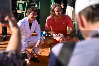2024-04-14 - Stefanos Tsitsipas and Charles Leclerc during the Rolex Monte-Carlo final ATP Masters 1000 tennis on April 14, 2024 at Monte Carlo Country Club in Roquebrune Cap Martin, France near Monaco. Photo Victor Joly / DPPI - TENNIS - ROLEX MONTE CARLO MASTERS 2024 - 14/04 - INTERNATIONALS - TENNIS