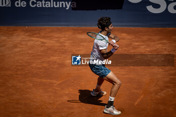 2024-04-19 - Tomas Etcheverry (Argentina) plays a backhand against Cameron Norrie (UK) during a quarterfinal ATP 500 Barcelona Open Banc Sabadell 2024 match at Real Club de Tenis de Barcelona, in Barcelona, Spain on April 19, 2024. Photo by Felipe Mondino - ATP 500 BARCELONA OPEN BANC SABADELL 2024 - CAMERON NORRIE (UK) VS TOMAS ETCHEVERRY (ARG) - INTERNATIONALS - TENNIS