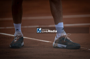 2024-04-21 - Feet of Stefanos Tsitsipas (Greece) are seen during the final ATP 500 Barcelona Open Banc Sabadell 2024 match at Real Club de Tenis de Barcelona, in Barcelona, Spain on April 21, 2024. Photo by Felipe Mondino - ATP 500 BARCELONA OPEN BANC SABADELL 2024 FINAL - STEFANOS TSITSIPAS (GRE) VS CASPER RUUD (NOR) - INTERNATIONALS - TENNIS