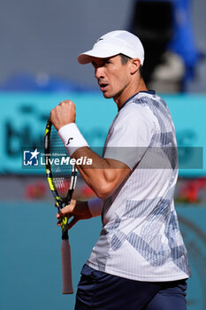 2024-04-22 - Facundo Bagnis of Argentina reacts against David Goffin of Belgium during the Mutua Madrid Open 2024, ATP Masters 1000 and WTA 1000, tennis tournament on April 22, 2024 at Caja Magica in Madrid, Spain - TENNIS - MUTUA MADRID OPEN 2024 - INTERNATIONALS - TENNIS