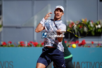2024-04-22 - Facundo Bagnis of Argentina in action against David Goffin of Belgium during the Mutua Madrid Open 2024, ATP Masters 1000 and WTA 1000, tennis tournament on April 22, 2024 at Caja Magica in Madrid, Spain - TENNIS - MUTUA MADRID OPEN 2024 - INTERNATIONALS - TENNIS