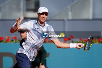 2024-04-22 - Facundo Bagnis of Argentina in action against David Goffin of Belgium during the Mutua Madrid Open 2024, ATP Masters 1000 and WTA 1000, tennis tournament on April 22, 2024 at Caja Magica in Madrid, Spain - TENNIS - MUTUA MADRID OPEN 2024 - INTERNATIONALS - TENNIS