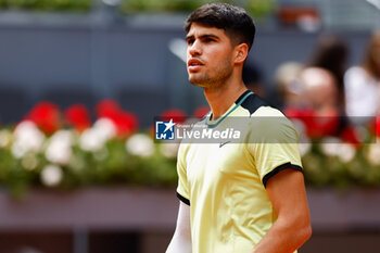 2024-04-26 - Carlos Alcaraz of Spain in action against Alexander Shevchenko of Kazakhstan during the Mutua Madrid Open 2024, ATP Masters 1000 and WTA 1000, tennis tournament on April 26, 2024 at Caja Magica in Madrid, Spain - TENNIS - MUTUA MADRID OPEN 2024 - INTERNATIONALS - TENNIS