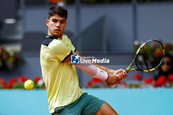 2024-04-26 - Carlos Alcaraz of Spain in action against Alexander Shevchenko of Kazakhstan during the Mutua Madrid Open 2024, ATP Masters 1000 and WTA 1000, tennis tournament on April 26, 2024 at Caja Magica in Madrid, Spain - TENNIS - MUTUA MADRID OPEN 2024 - INTERNATIONALS - TENNIS