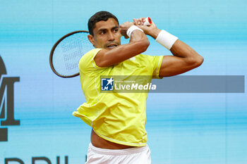 2024-04-27 - Thiago Monteiro of Brazil in action against Stefanos Tsisipas of Greece during the Mutua Madrid Open 2024, ATP Masters 1000 and WTA 1000, tennis tournament on April 27, 2024 at Caja Magica in Madrid, Spain - TENNIS - MUTUA MADRID OPEN 2024 - INTERNATIONALS - TENNIS