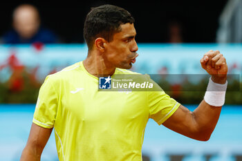 2024-04-27 - Thiago Monteiro of Brazil in action against Stefanos Tsisipas of Greece during the Mutua Madrid Open 2024, ATP Masters 1000 and WTA 1000, tennis tournament on April 27, 2024 at Caja Magica in Madrid, Spain - TENNIS - MUTUA MADRID OPEN 2024 - INTERNATIONALS - TENNIS