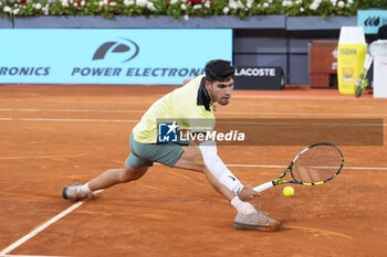 2024-05-01 - Carlos Alcaraz of Spain in action against Andrey Rublev of Russia during the Mutua Madrid Open 2024, ATP Masters 1000 and WTA 1000, tennis tournament on May 1, 2024 at Caja Magica in Madrid, Spain - TENNIS - MUTUA MADRID OPEN 2024 - INTERNATIONALS - TENNIS