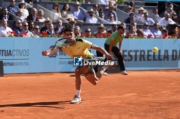 2024-04-30 - Carlos Alcaraz of Spain in action against Jan-Lennard Struff of Germany during the Mutua Madrid Open 2024, ATP Masters 1000 and WTA 1000, tennis tournament on April 30, 2024 at Caja Magica in Madrid, Spain - TENNIS - MUTUA MADRID OPEN 2024 - INTERNATIONALS - TENNIS