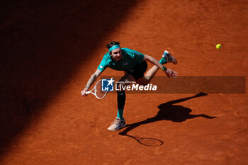 2024-04-30 - Alexander Bublik of Kazakhstan in action against Daniil Medvedev of Russia during the Mutua Madrid Open 2024, ATP Masters 1000 and WTA 1000, tennis tournament on April 30, 2024 at Caja Magica in Madrid, Spain - TENNIS - MUTUA MADRID OPEN 2024 - INTERNATIONALS - TENNIS