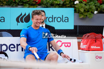 03/05/2024 - Jiri Lehecka of Czech Republic gets injured and takes the medical time during his match against Felix Auger Aliassime of Canada during the Mutua Madrid Open 2024, ATP Masters 1000 and WTA 1000, tennis tournament on May 3, 2024 at Caja Magica in Madrid, Spain - TENNIS - MUTUA MADRID OPEN 2024 - INTERNAZIONALI - TENNIS
