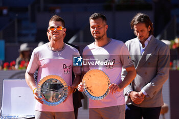 2024-05-04 - Ariel Behar of Uruguay and Adam Pavlasek of Czech Republic celebrate with the runner-up trophy after losing the doubles tournament against Sebastian Korda of United States and Jordan Thompson of Australia during the Mutua Madrid Open 2024, ATP Masters 1000 and WTA 1000, tennis tournament on May 4, 2024 at Caja Magica in Madrid, Spain - TENNIS - MUTUA MADRID OPEN 2024 - INTERNATIONALS - TENNIS