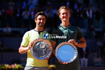 2024-05-04 - Sebastian Korda of United States and Jordan Thompson of Australia celebrate with the trophy after winning the doubles tournament against Ariel Behar of Uruguay and Adam Pavlasek of Czech Republic during the Mutua Madrid Open 2024, ATP Masters 1000 and WTA 1000, tennis tournament on May 4, 2024 at Caja Magica in Madrid, Spain - TENNIS - MUTUA MADRID OPEN 2024 - INTERNATIONALS - TENNIS