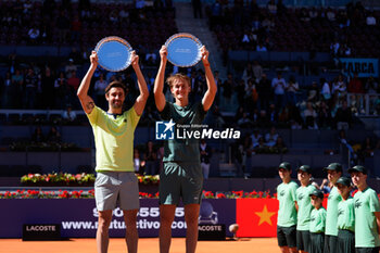 04/05/2024 - Sebastian Korda of United States and Jordan Thompson of Australia celebrate with the trophy after winning the doubles tournament against Ariel Behar of Uruguay and Adam Pavlasek of Czech Republic during the Mutua Madrid Open 2024, ATP Masters 1000 and WTA 1000, tennis tournament on May 4, 2024 at Caja Magica in Madrid, Spain - TENNIS - MUTUA MADRID OPEN 2024 - INTERNAZIONALI - TENNIS