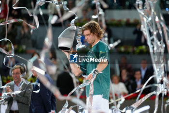 05/05/2024 - Andrey Rublev of Russia celebrates with the winner trophy after winning against Felix Auger-Aliassime of Canada during the Mutua Madrid Open 2024, ATP Masters 1000 and WTA 1000, tennis tournament on May 5, 2024 at Caja Magica in Madrid, Spain - TENNIS - MUTUA MADRID OPEN 2024 - INTERNAZIONALI - TENNIS