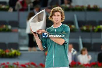 05/05/2024 - Andrey Rublev of Russia celebrates with the winner trophy after winning against Felix Auger-Aliassime of Canada during the Mutua Madrid Open 2024, ATP Masters 1000 and WTA 1000, tennis tournament on May 5, 2024 at Caja Magica in Madrid, Spain - TENNIS - MUTUA MADRID OPEN 2024 - INTERNAZIONALI - TENNIS