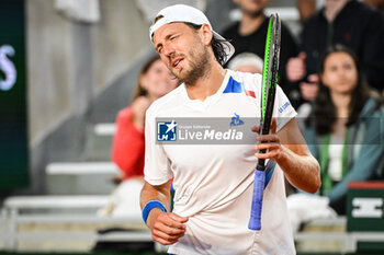 2024-05-20 - Lucas POUILLE of France looks dejected during first qualifying day of Roland-Garros 2024, ATP and WTA Grand Slam tennis tournament on May 20, 2024 at Roland-Garros stadium in Paris, France - TENNIS - ROLAND GARROS 2024 - PREVIEWS - INTERNATIONALS - TENNIS