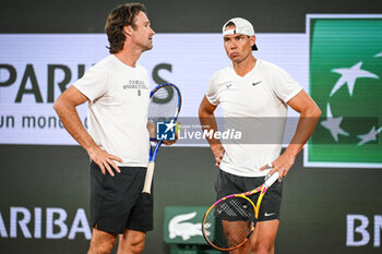 2024-05-20 - Rafael NADAL of Spain with his coach Carlos MOYA during a training session of Roland-Garros 2024, ATP and WTA Grand Slam tennis tournament on May 20, 2024 at Roland-Garros stadium in Paris, France - TENNIS - ROLAND GARROS 2024 - PREVIEWS - INTERNATIONALS - TENNIS