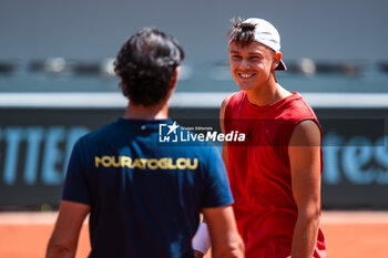 2024-05-21 - Holger RUNE (DEN) and coach Patrick MOURATOGLOU (FRA) during the Roland-Garros 2024, ATP and WTA Grand Slam tennis tournament on May 21, 2024 at Roland-Garros stadium in Paris, France - TENNIS - ROLAND GARROS 2024 - PREVIEW - INTERNATIONALS - TENNIS