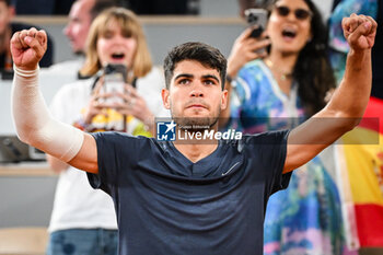 2024-05-26 - Carlos ALCARAZ of Spain celebrates his victory during the first day of Roland-Garros 2024, ATP and WTA Grand Slam tennis tournament on May 26, 2024 at Roland-Garros stadium in Paris, France - TENNIS - ROLAND GARROS 2024 - 26/05 - INTERNATIONALS - TENNIS