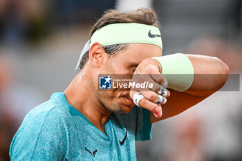 2024-05-27 - Rafael NADAL of Spain looks dejected during the second day of Roland-Garros 2024, ATP and WTA Grand Slam tennis tournament on May 27, 2024 at Roland-Garros stadium in Paris, France - TENNIS - ROLAND GARROS 2024 - 27/05 - INTERNATIONALS - TENNIS