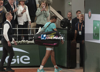 2024-05-27 - Rafael Nadal of Spain leaves the court following his first round match defeat against Alexander Zverev aka Sascha Zverev of Germany on day 2 of the 2024 French Open, Roland-Garros 2024, Grand Slam tennis tournament on May 27, 2024 at Roland-Garros stadium in Paris, France - TENNIS - ROLAND GARROS 2024 - 27/05 - INTERNATIONALS - TENNIS