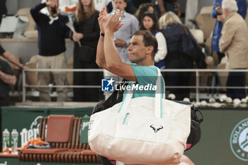 2024-05-27 - Rafael Nadal of Spain salutes the crowd following his first round match defeat against Alexander Zverev aka Sascha Zverev of Germany on day 2 of the 2024 French Open, Roland-Garros 2024, Grand Slam tennis tournament on May 27, 2024 at Roland-Garros stadium in Paris, France - TENNIS - ROLAND GARROS 2024 - 27/05 - INTERNATIONALS - TENNIS