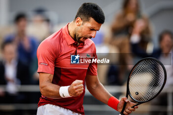 2024-06-03 - Novak DJOKOVIC of Serbia celebrates his victory during the ninth day of Roland-Garros 2024, ATP and WTA Grand Slam tennis tournament on June 03, 2024 at Roland-Garros stadium in Paris, France - TENNIS - ROLAND GARROS 2024 - 03/06 - INTERNATIONALS - TENNIS