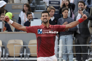 2024-06-03 - Novak Djokovic of Serbia celebrates his fourth round victory against Francisco Cerundolo of Argentina during day 9 of the 2024 French Open, Roland-Garros 2024, Grand Slam tennis tournament on June 3, 2024 at Roland-Garros stadium in Paris, France - TENNIS - ROLAND GARROS 2024 - 03/06 - INTERNATIONALS - TENNIS