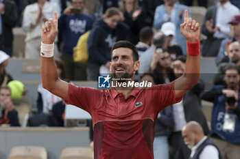 2024-06-03 - Novak Djokovic of Serbia celebrates his fourth round victory against Francisco Cerundolo of Argentina during day 9 of the 2024 French Open, Roland-Garros 2024, Grand Slam tennis tournament on June 3, 2024 at Roland-Garros stadium in Paris, France - TENNIS - ROLAND GARROS 2024 - 03/06 - INTERNATIONALS - TENNIS