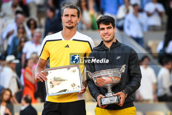2024-06-09 - Carlos ALCARAZ of Spain and Alexander ZVEREV of Germany celebrate with the trophies during the fifteenth day of Roland-Garros 2024, ATP and WTA Grand Slam tennis tournament on June 09, 2024 at Roland-Garros stadium in Paris, France - TENNIS - ROLAND GARROS 2024 - 09/06 - INTERNATIONALS - TENNIS