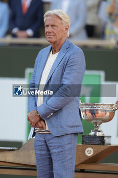 2024-06-09 - Trophy presenter Bjorn Borg during the podium ceremony of the men's final on day 15 of the 2024 French Open, Roland-Garros 2024, Grand Slam tennis tournament on June 9, 2024 at Roland-Garros stadium in Paris, France - TENNIS - ROLAND GARROS 2024 - 09/06 - INTERNATIONALS - TENNIS
