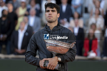 2024-06-09 - Winner Carlos Alcaraz of Spain during the podium ceremony of the men's final on day 15 of the 2024 French Open, Roland-Garros 2024, Grand Slam tennis tournament on June 9, 2024 at Roland-Garros stadium in Paris, France - TENNIS - ROLAND GARROS 2024 - 09/06 - INTERNATIONALS - TENNIS