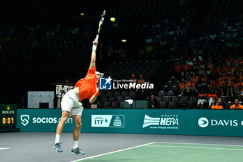 2024-09-10 - BOLOGNA, ITALY - 10 September: The Dutchman Botic van de Zandschulp serving in the match against the Belgian Raphael Collignon during the Netherlands vs Belgium match at the Unipol Arena in Bologna - DAVIS CUP - INTERNATIONALS - TENNIS