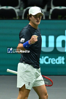 2024-09-12 - Joao Fonseca (BRA) in action during the 2024 Davis Cup Finals Group Stage Bologna match between the Netherlands and Brazil at Unipol Arena on September 12, 2024 in Bologna, Italy. - DAVIS CUP - INTERNATIONALS - TENNIS