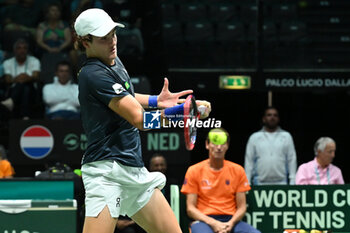 2024-09-12 - Joao Fonseca (BRA) in action during the 2024 Davis Cup Finals Group Stage Bologna match between the Netherlands and Brazil at Unipol Arena on September 12, 2024 in Bologna, Italy. - DAVIS CUP - INTERNATIONALS - TENNIS