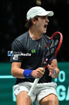 2024-09-12 - Joao Fonseca (BRA) in action during the 2024 Davis Cup Finals Group Stage Bologna match between the Netherlands and Brazil at Unipol Arena on September 12, 2024 in Bologna, Italy. - DAVIS CUP - INTERNATIONALS - TENNIS