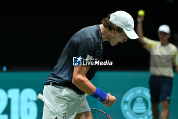 2024-09-12 - Joao Fonseca (BRA) in action during the 2024 Davis Cup Finals Group Stage Bologna match between the Netherlands and Brazil at Unipol Arena on September 12, 2024 in Bologna, Italy. - DAVIS CUP - INTERNATIONALS - TENNIS