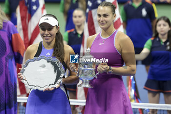 2024-09-08 - Finalist Jessica Pegula of USA, winner Aryna Sabalenka of Belarus during the podium ceremony of the women's final during day 13 of the 2024 US Open, Grand Slam tennis tournament on 7 September 2024 at USTA Billie Jean King National Tennis Center in New York, United States - TENNIS - US OPEN 2024 - 07/09 - INTERNATIONALS - TENNIS