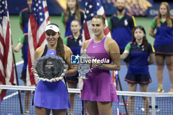 2024-09-08 - Finalist Jessica Pegula of USA, winner Aryna Sabalenka of Belarus during the podium ceremony of the women's final during day 13 of the 2024 US Open, Grand Slam tennis tournament on 7 September 2024 at USTA Billie Jean King National Tennis Center in New York, United States - TENNIS - US OPEN 2024 - 07/09 - INTERNATIONALS - TENNIS